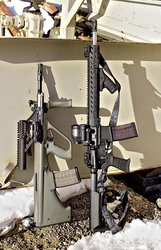 The AUG sitting next a 16-inch barreled AR-15 . Short of an sbr, you won’t find a more compact overall “legal” package. 