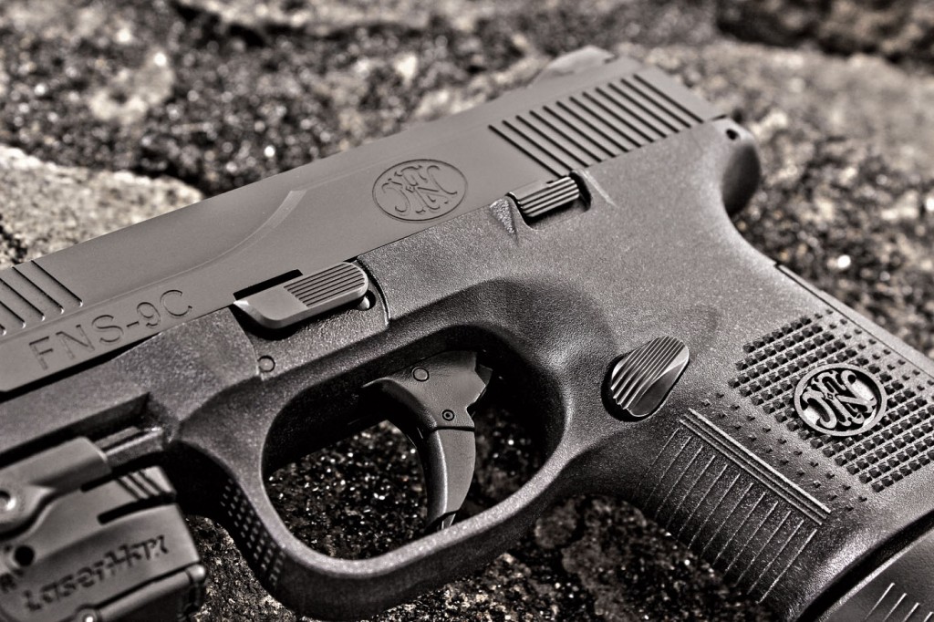 Controls are large and heavily serrated, and the trigger reach is comfortable on the FNS-9C.