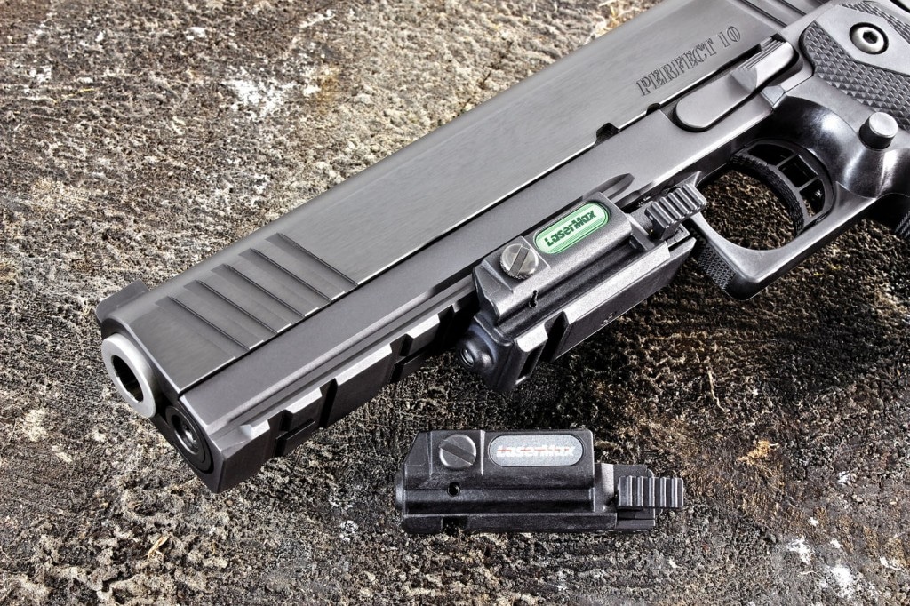A full length accessory rail adds to the pistol's menacing look. Shown here are the green and I.R. Unimax lasers from LaserMax.