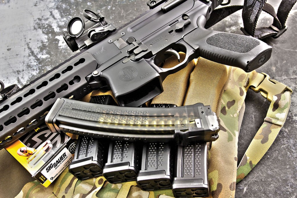 SIG ships the MPX with one translucent-smoked Lancer 30-round magazine; ease-of-loading was outstanding and function 100-percent perfect. Speed-reloads were assisted by the heavily-flared magwell. The MPX is show here resting on a Blue Force Gear PLATEminus armor carrier and Ten-Speed Quad MP7 Mag Pouch.