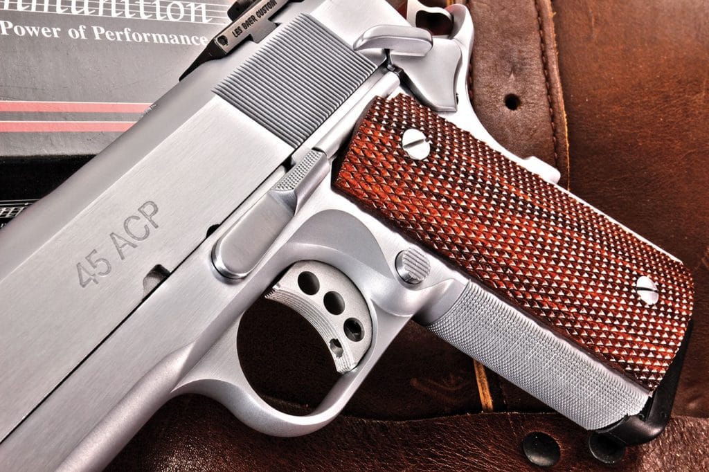 Sharply-checkered walnut grips, combined with expertly-cut 30 line-per-inch checkering on the front strap of the frame, offered great traction and good control under recoil. The slide stop is also checkered, while the mag release and thumb safety bearing surfaces are serrated.