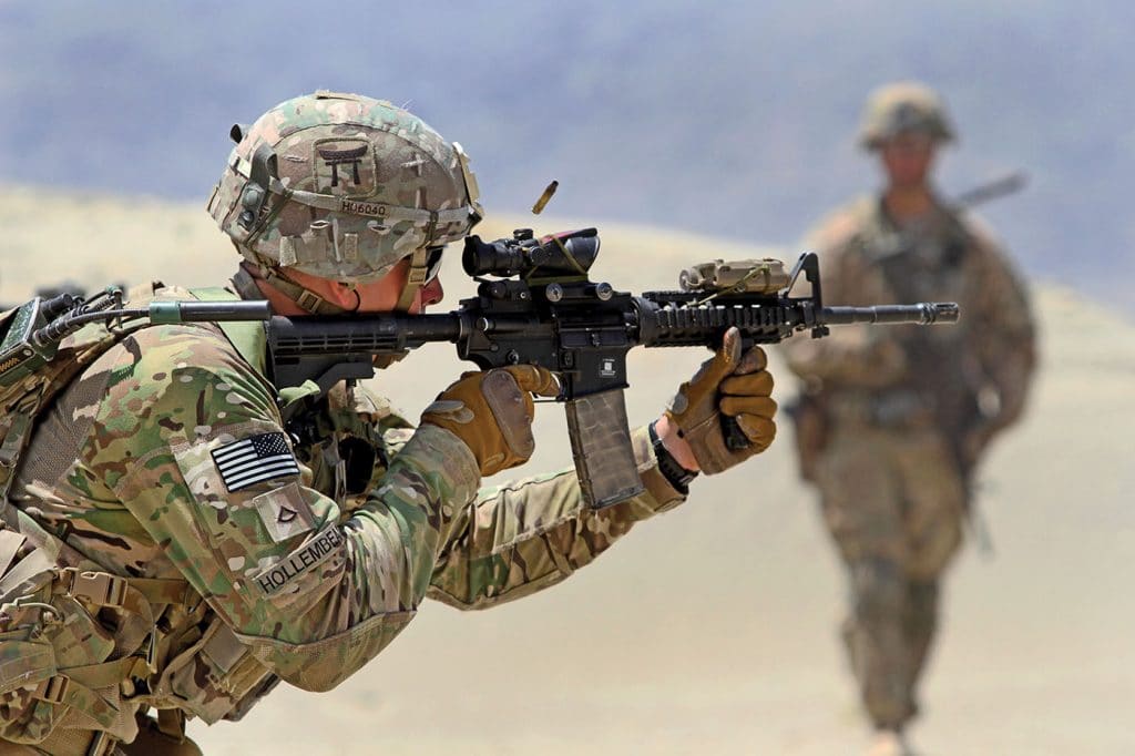 Pfc. Charles Hollembeak, a 101st Airborne Division infantryman, fires an M4 carbine during partnered live-fire range training May 29, 2015, at Tactical Base Gamberi in eastern Afghanistan. (U.S. Army photo by Capt. Charlie Emmons, TAAC-E Public Affairs)