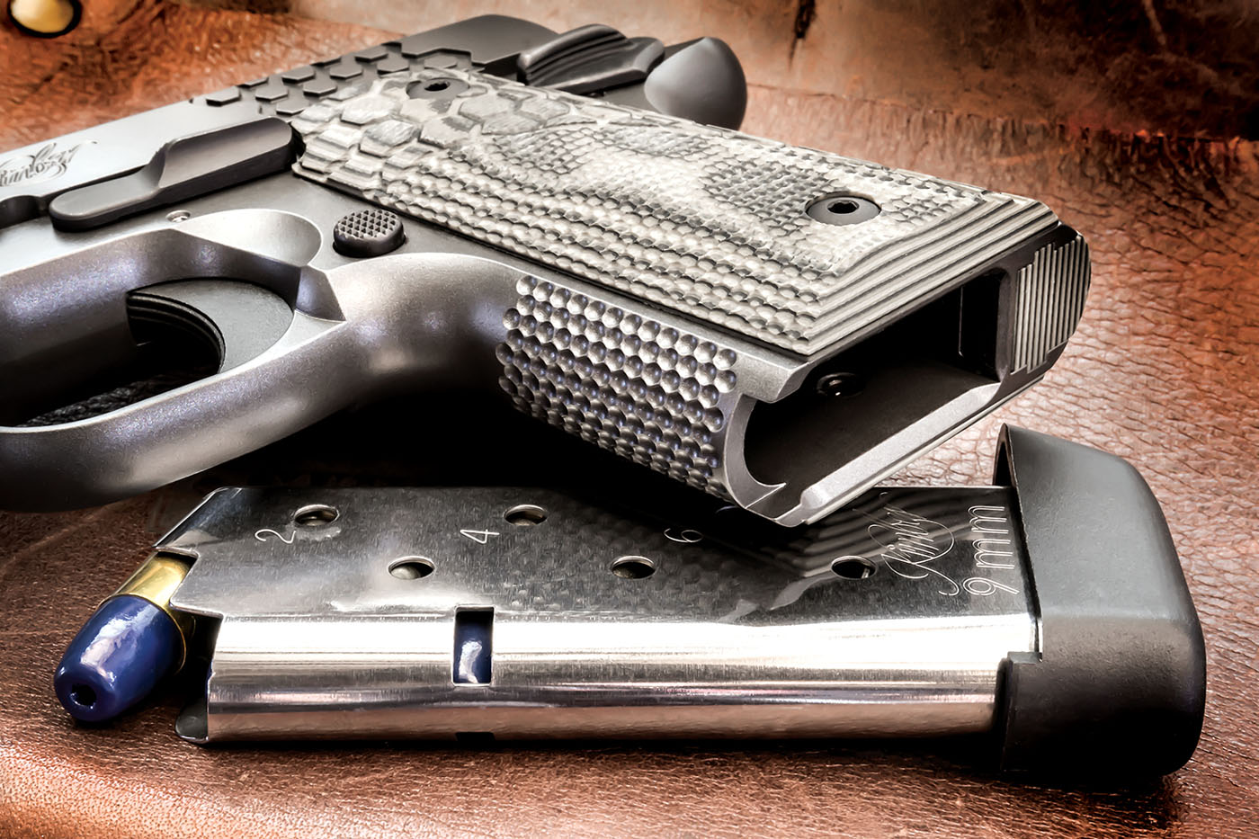 The Micro 9 feeds from a 7-round magazine, with a baseplate that creates a ...